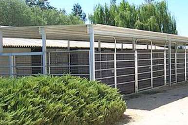 Large winery crush pad covers spanning multiple fermentation tanks and workstations
